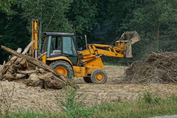 istock one old brown excavator with a bucket 1338114841