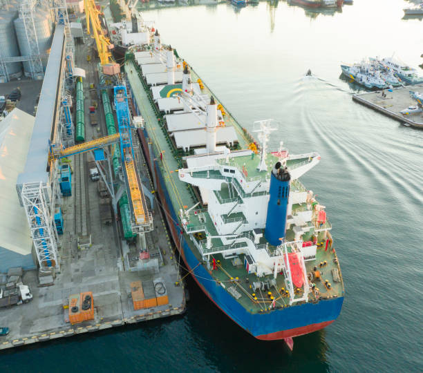 istock A cargo ship at the pier in the port. The loading process is in progress. View from above. 1338117500