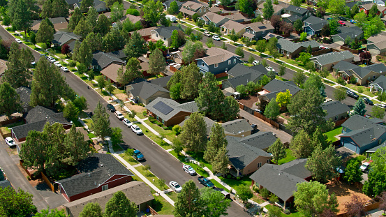 Aerial view of a suburban neighborhood in the Old Farm District in Bend, Oregon on a sunny day in summer.