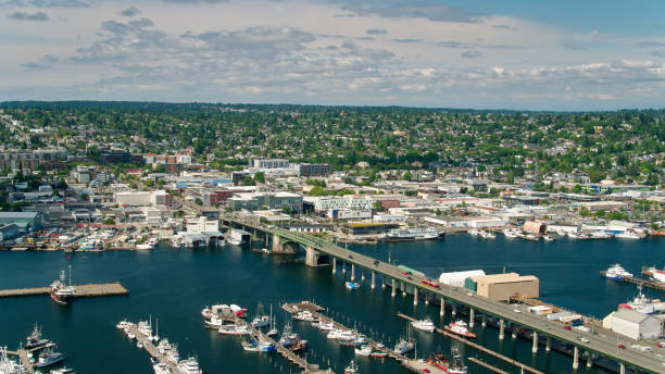 Aerial View Over Salmon Bay in Seattle Towards Ballard Aerial shot of Seattle, Washington on a sunny day in summer, looking down on the Lake Washington Ship Canal between North Queen Anne and Ballard. ballard-seattle stock pictures, royalty-free photos & images