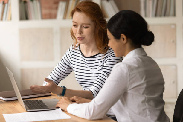 istock Manager consult to Indian client using laptop showing online presentation 1338121821