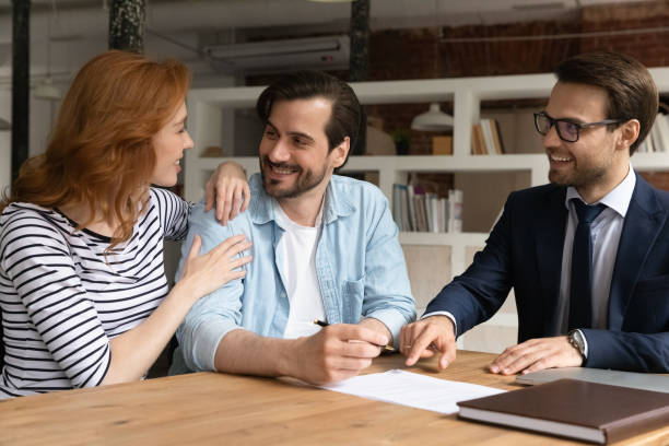 istock Couple take bank mortgage put signature on contract document 1338121828