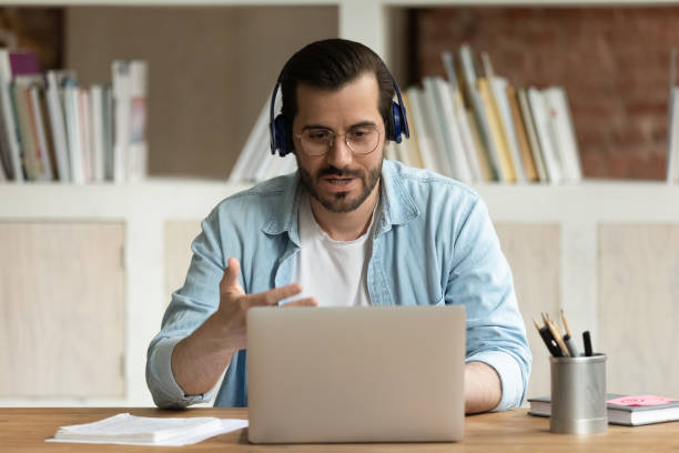 istock Serious man takes part in online stream communication use laptop 1338121933