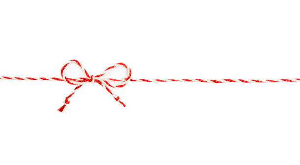 istock Red twine rope isolated on white background, christmas package. A string of rope with a bow. 1338124887