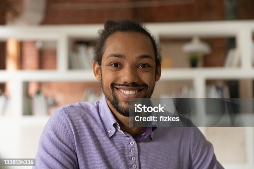 istock Headshot portrait African 30s man smile look at camera 1338134336