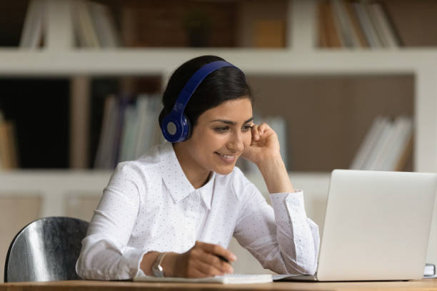 istock Indian student woman prepare for exams learn subject use webinar 1338134340