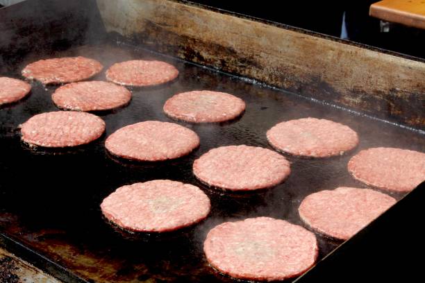 istock Burgers Fresh On The Grill 1338143417