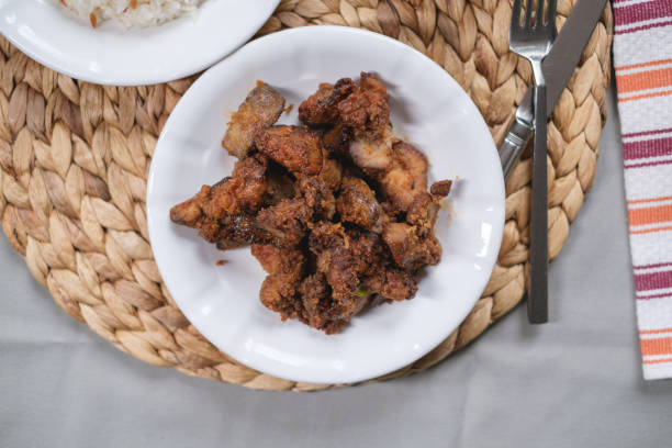 istock Fried Chicken Liver in plate served with rice 1338143427