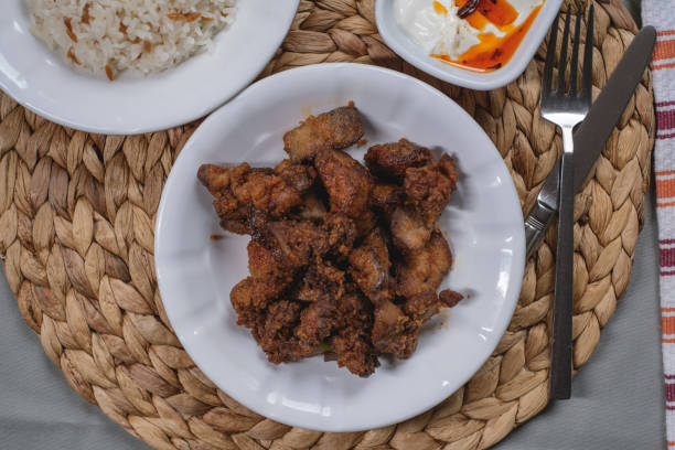 istock Fried Chicken Liver in plate served with rice 1338143469