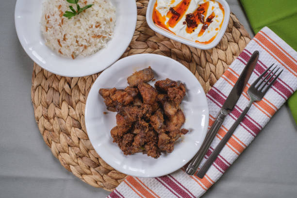 istock Fried Chicken Liver in plate served with rice 1338143477