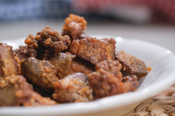 istock Fried Chicken Liver in plate served with rice 1338144500