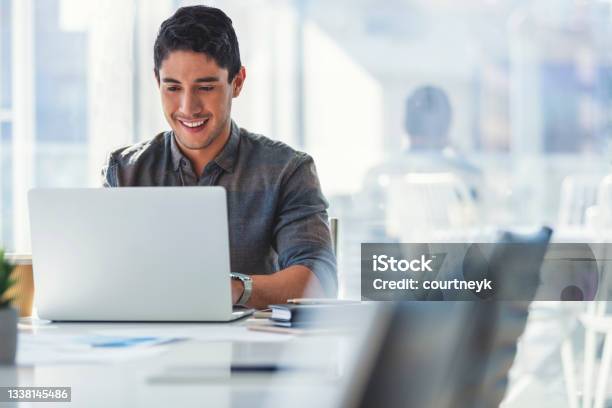 Businessman Working On A Laptop Computer In The Office Stock Photo - Download Image Now