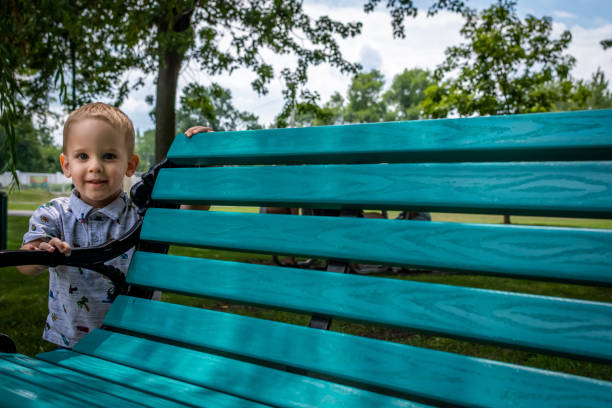 Young boy having fun in public park Pie-XII of Trois-Rivières city, Quebec, during summer.