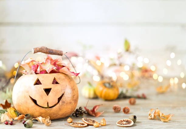 istock Autumn Jack O' Lantern against an old wood background 1338148432