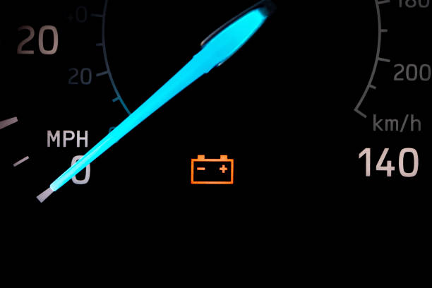Car battery warning light on dashboard. Vehicle repair, maintenance, service and dead battery concept.