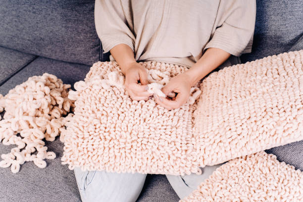 istock Knits made from thick soft yarn. Soft knitted cushions made of thick yarn. 1338162016