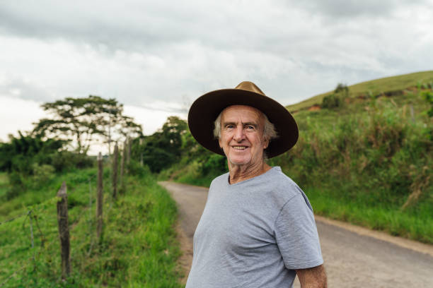 Portrait of a senior farmer on a country road