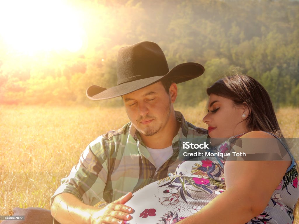 Cowboy And Wife Romantic Photo With Husband Touching Her Round ...