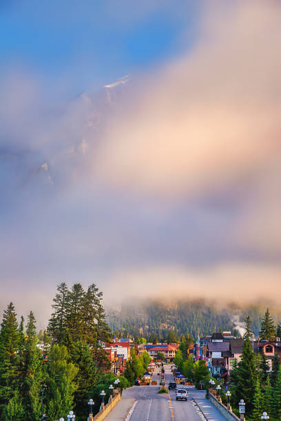 istock Misty Clouds Over The Banff Town Road 1338167682