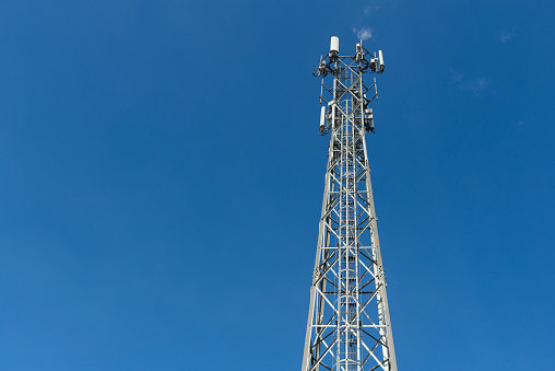 Antenna Tower of Communication on blue sky, Mobile phone antenna tower.