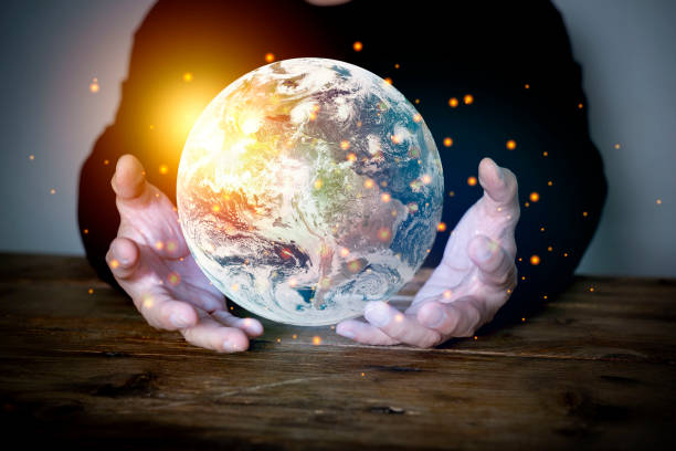 istock Earth at night was holding in human hands. Earth day. 1338180724