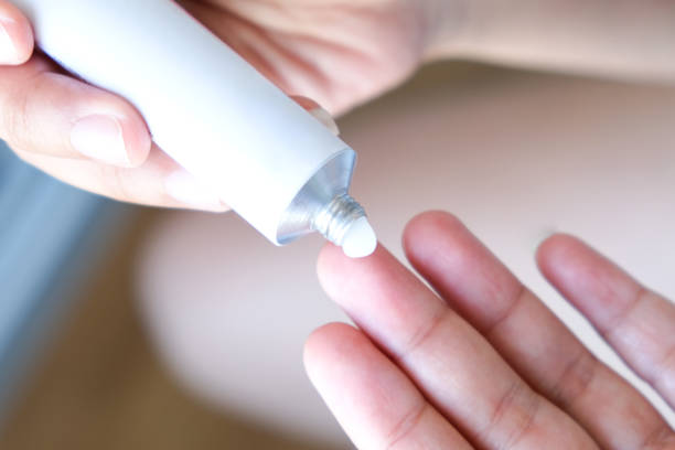 istock The woman's hand, she uses steroids Apply External type 1338182561