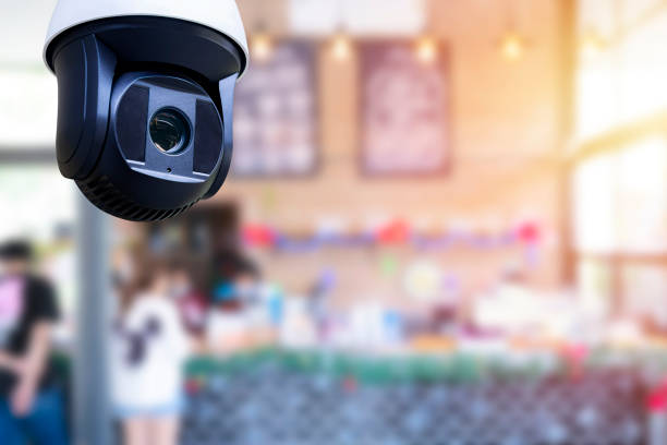 istock Security CCTV camera or surveillance system in a coffee shop. 1338182803