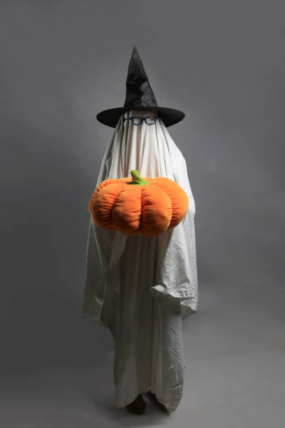 istock Person dressed as a ghost on halloween.
Halloween.  October 31st. 1338190469