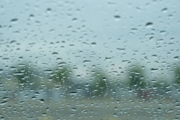istock raindrops on car windscreen in a parking lot 1338192755