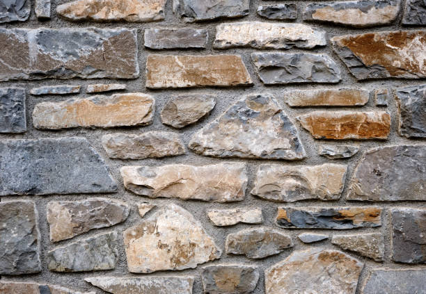Irregular natural stone wall stock photo