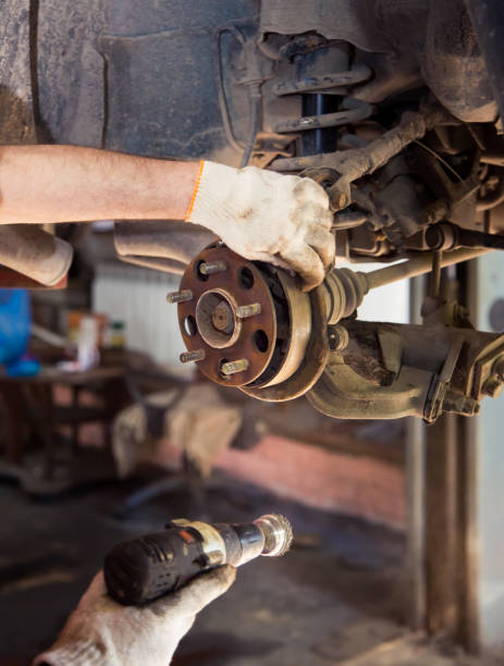 istock Use a power tool to remove rust from the worn rear wheel hub. 1338195375