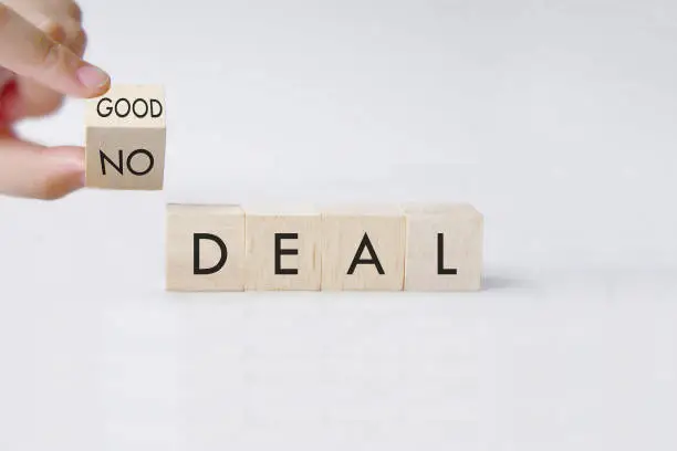 No deal or a good deal? Hand turns a dice and changes the expression "no deal" to "good deal", or vice versa.