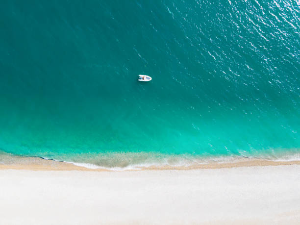 istock Tropical beach with turquoise water. Aerial drone view. 1338198379