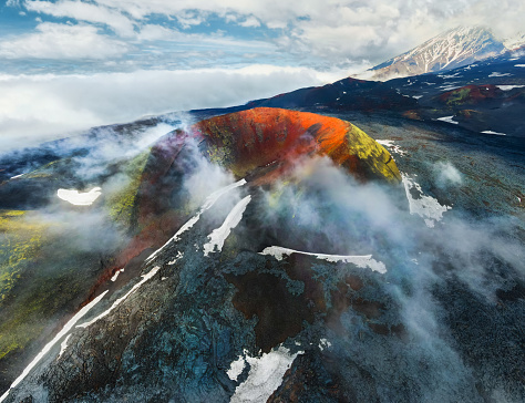 Volcano craters and black lava fields near Tolbachik volcano in Kamchatka peninsula, Russia. Aerial drone view. Kleshnya crater of Tolbachik volcano