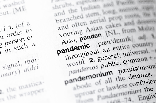 Pandemic word closeup in English dictionary