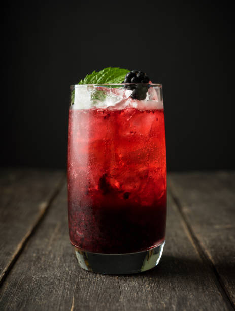 istock Blackberry cocktail with crushed ice on the rustic wooden background. Selective focus. Shallow depth of field. 1338200572