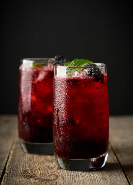 istock Blackberry cocktail with crushed ice on the rustic wooden background. Selective focus. Shallow depth of field. 1338200575
