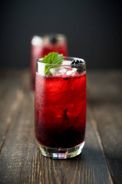 istock Blackberry cocktail with crushed ice on the rustic wooden background. Selective focus. Shallow depth of field. 1338200576