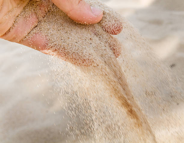 istock Sand strewed to fingers. 133820081