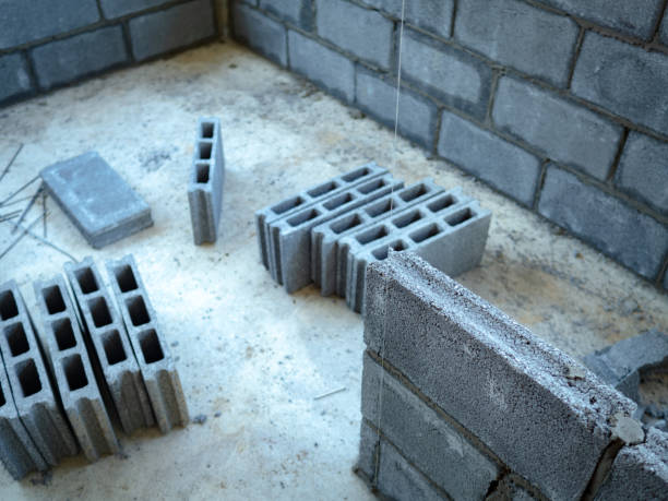 istock Selective Focus. Concrete block wall form work commonly hollow concrete block. It used economical building material for a wide variety of construction applications in many residential 1338201723