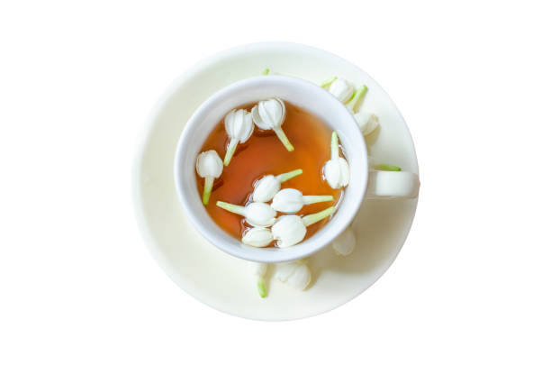 A cup of tea with fresh jasmine flower isolated on white background