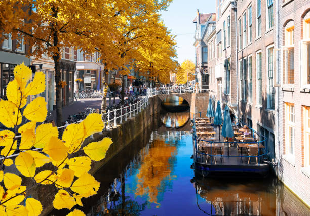 street with canal in Delft old town in Holland at fall