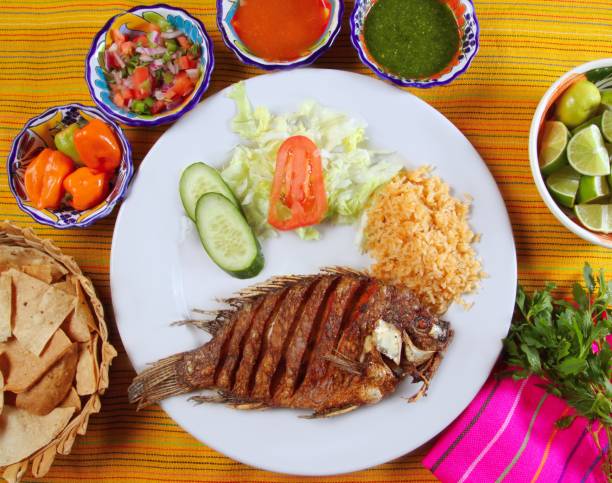 istock fried mojarra tilapia fish Mexico style with chili sauce 1338208482
