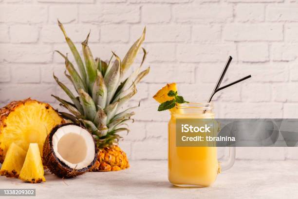 Tropical Pineapple Smoothie In A Mason Jar Stock Photo - Download Image Now - Pina Colada, Smoothie, Juice - Drink