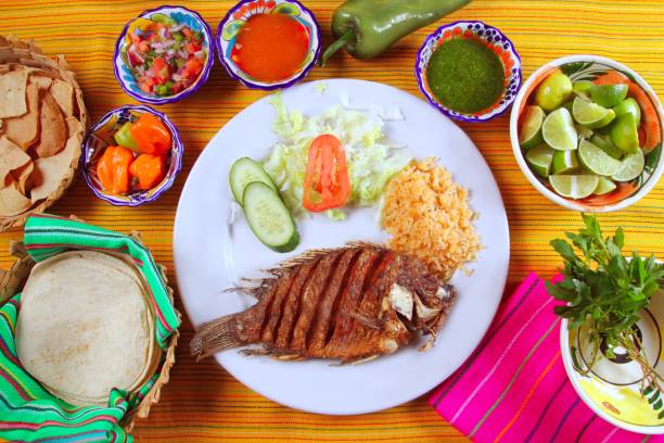 istock fried mojarra tilapia fish Mexico style with chili sauce 1338209474