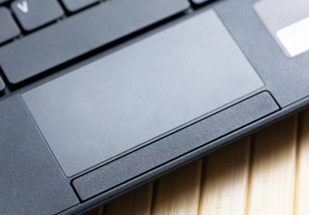 istock Simple black laptop trackpad, modern touchpad with physical buttons top view, closeup. Netbook track pad top view, from above, up close. Ways of computer digital input, mouse alternative concept 1338213859