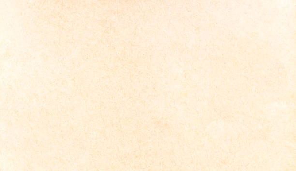 istock Old antique stylish yellowed parchment, worn paper design abstract creative background texture, full frame, copy space. Simple dated yellowish empty paper page structure, surface top view, closeup 1338213862