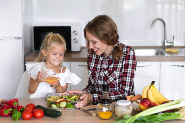 istock A mother and daughter in the kitchen 1338215719