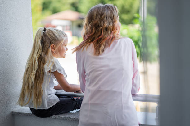 istock Mother and daughter on the balcony 1338216597
