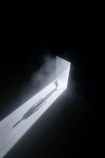 istock Walking Through The Doorway Into Darkness 1338220775